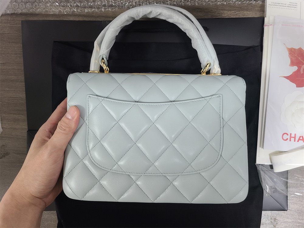 Ch*el flap bag with top handle 6.6 × 9.8 × 4.7 in