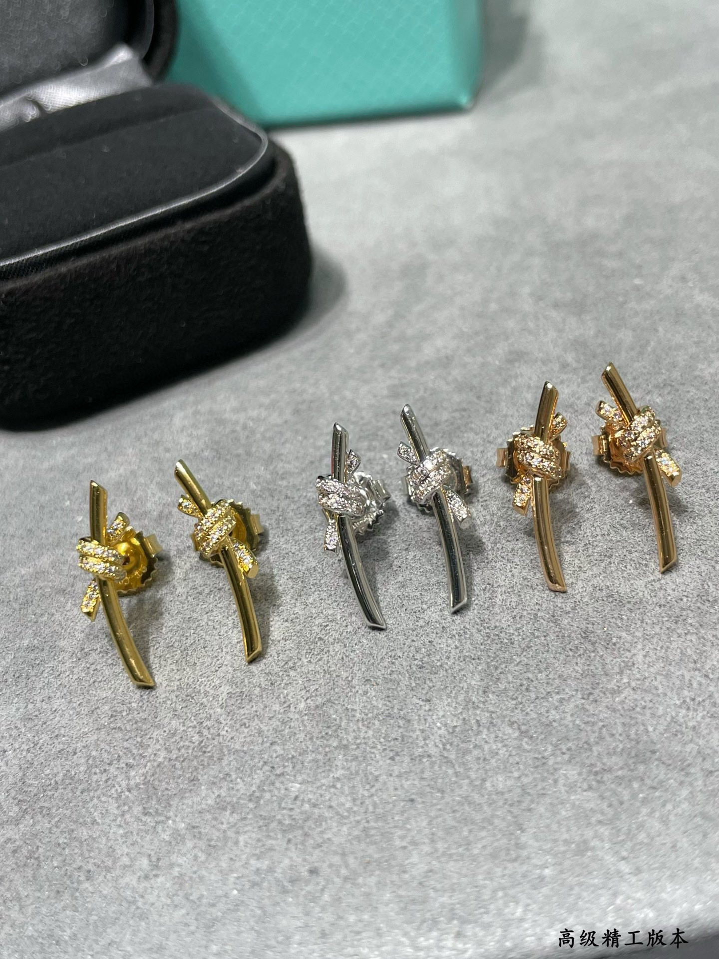 t*f*ny & co. half-Di*m*nd t wire knot stud earrings