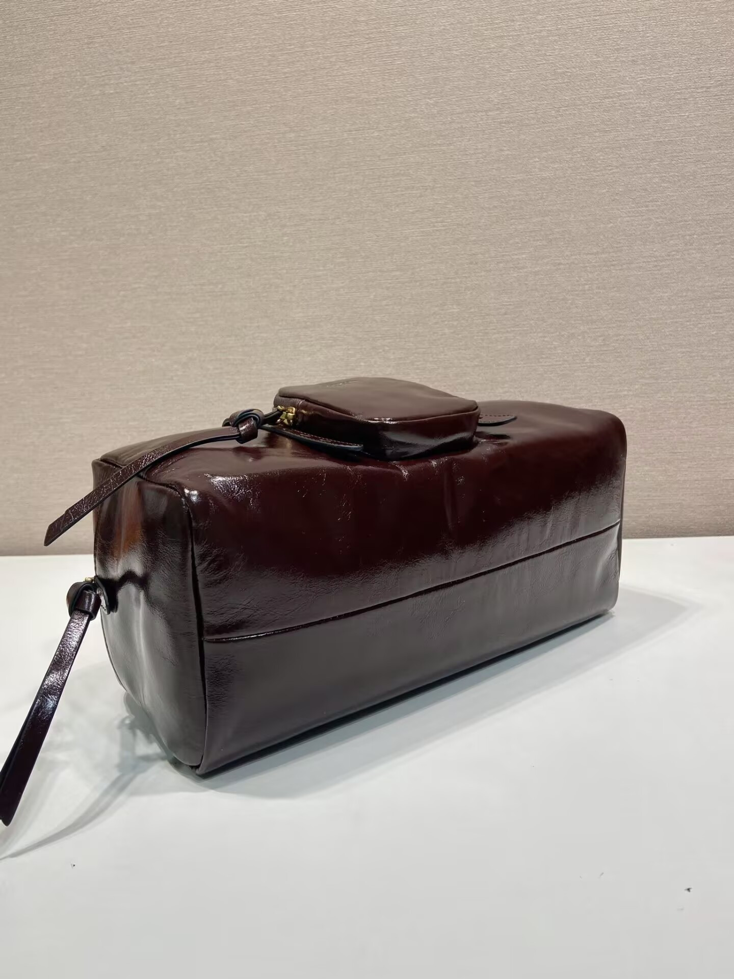 Pra*a dangle medium leather top-handle bag 14x30x13.5cm