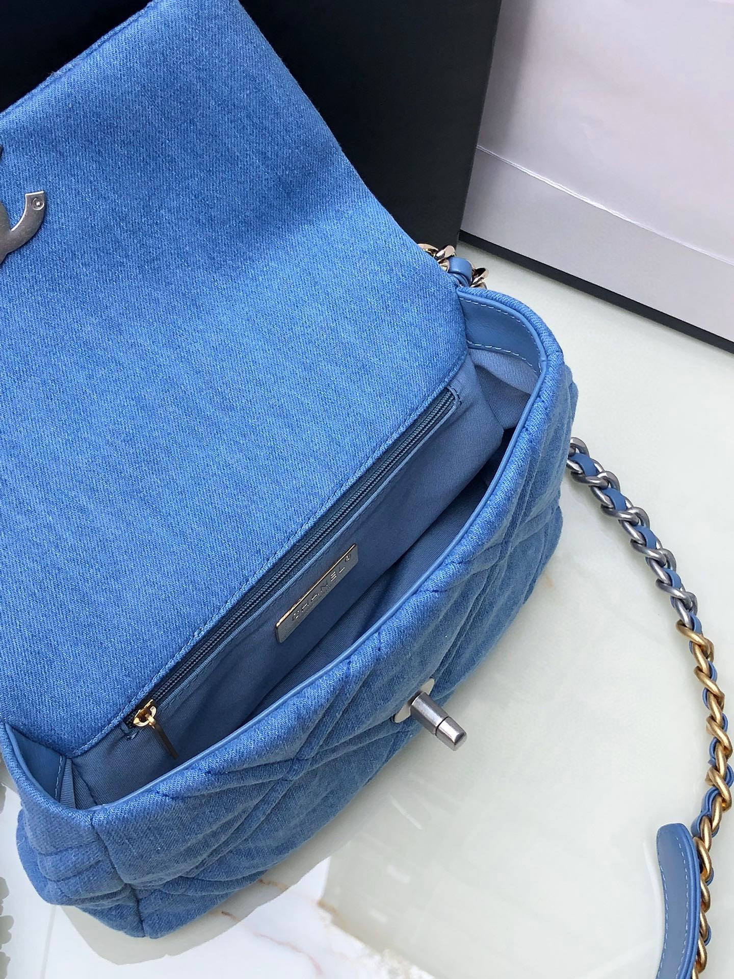 Ch*el 19 handbag, gold-tone, silver-tone & ruthenium-finish metal blue 6.2 × 10.1 × 3.5 in