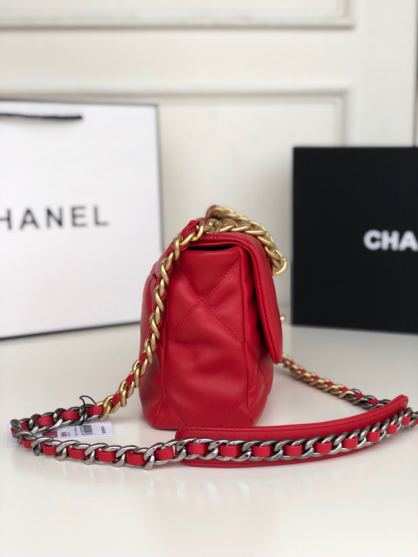 Ch*el 19 handbag shiny leather, gold-tone, silver-tone & ruthenium-finish metal red 6.2 × 10.1 × 3.5 in