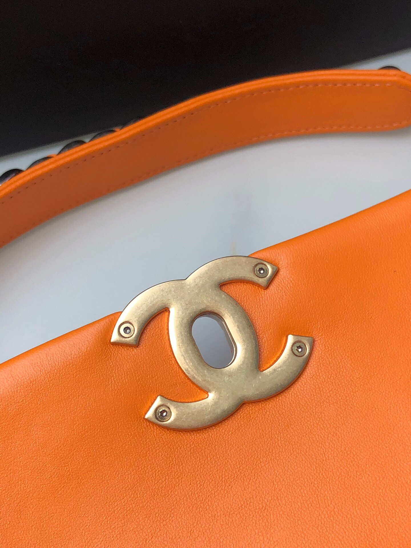 Ch*el 19 large handbag shiny leather, gold-tone, silver-tone & ruthenium-finish metal orange 7.8 × 11.7 × 3.9 in