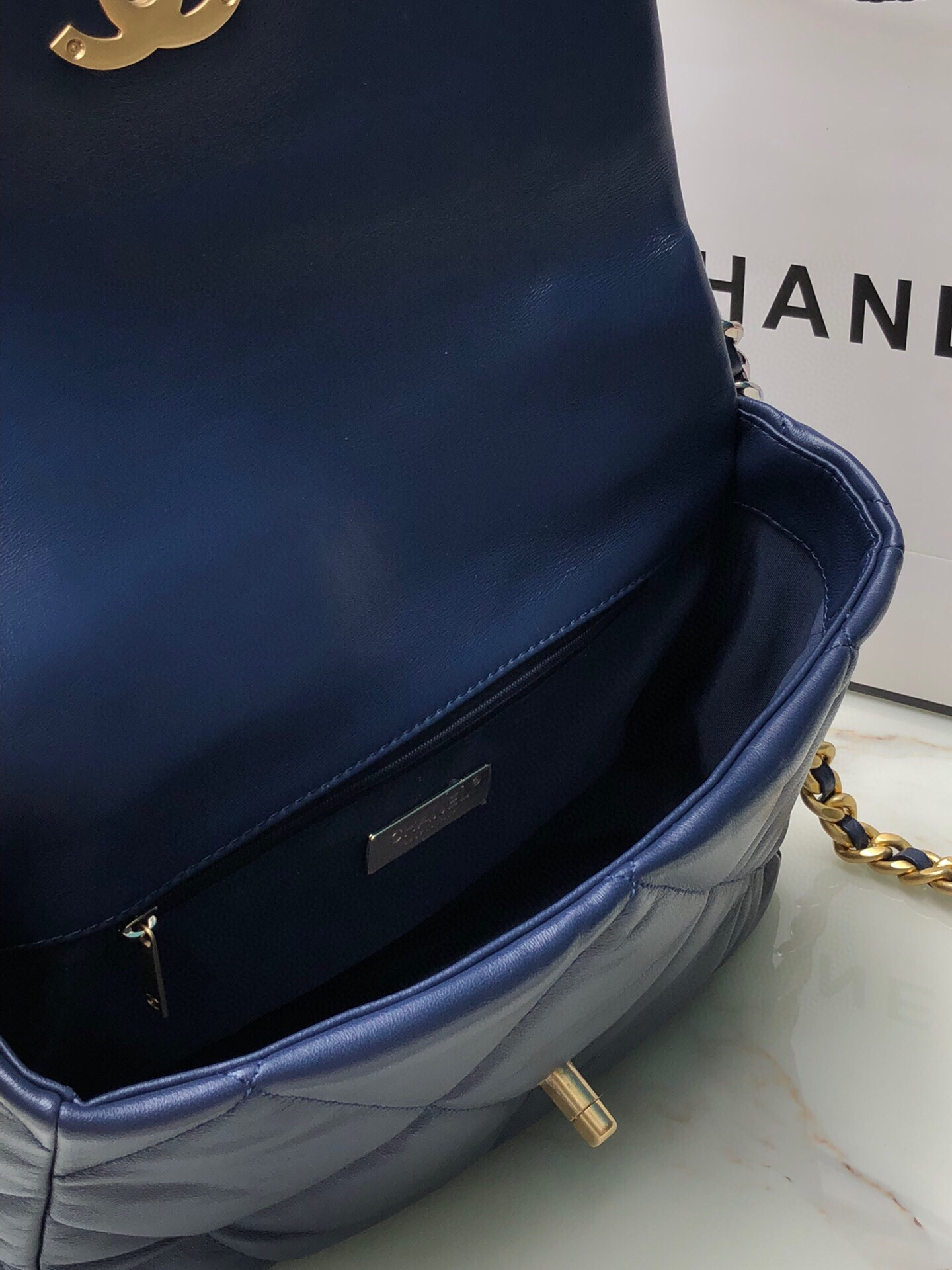Ch*el 19 large handbag shiny leather, gold-tone, silver-tone & ruthenium-finish metal navy 7.8 × 11.7 × 3.9 in