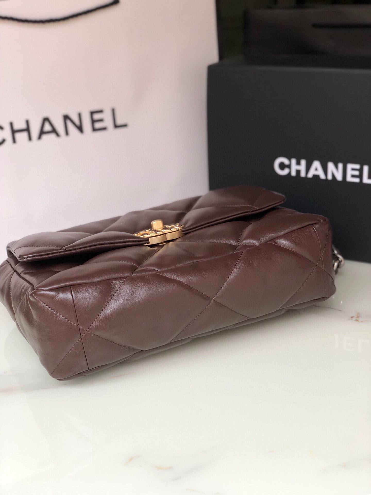 Ch*el 19 large handbag shiny leather, gold-tone, silver-tone & ruthenium-finish metal brown 7.8 × 11.7 × 3.9 in
