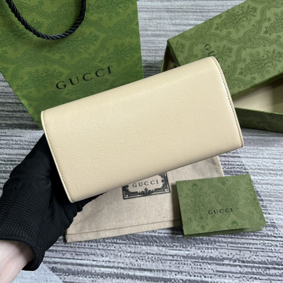 continental wallet with G*u*i script light yellow 7.5"w x 4"h x 1.4"d