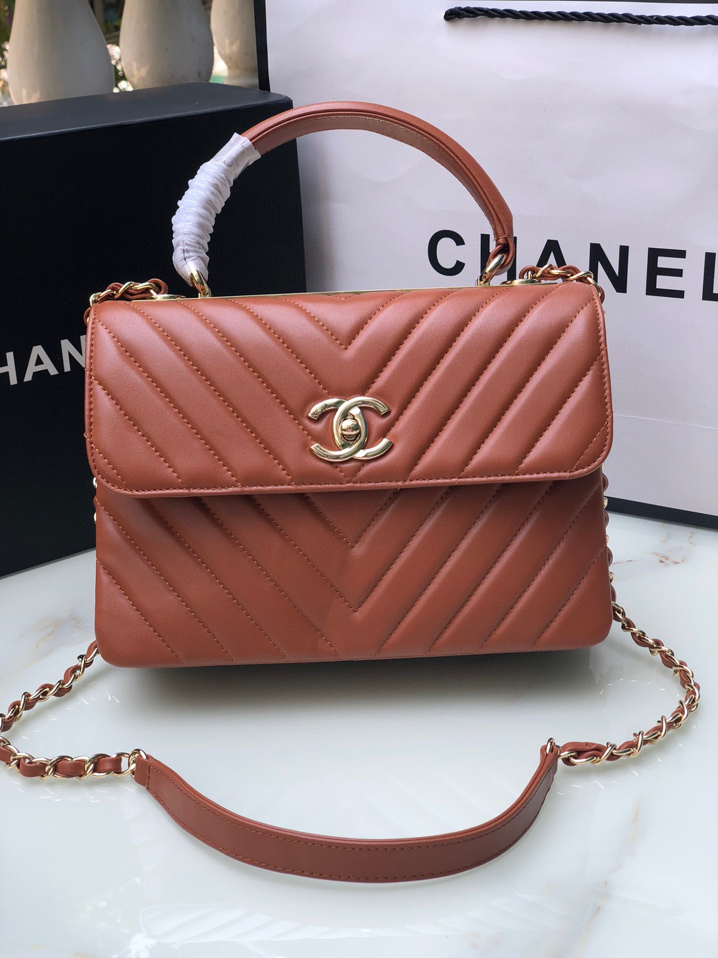 Ch*el flap bag with top handle orange 6.6 × 9.8 × 4.7 in