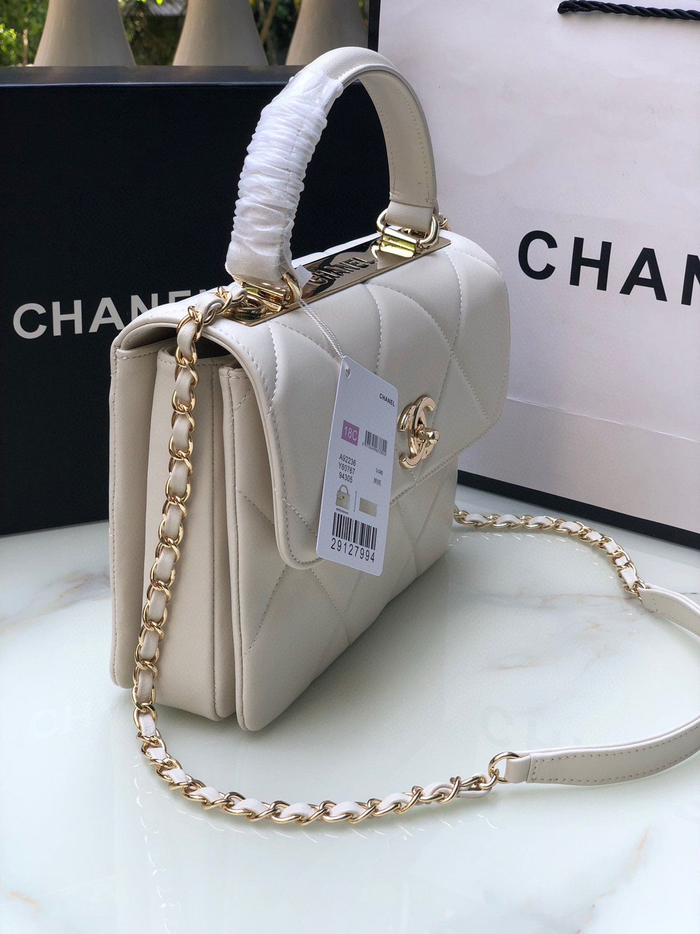 Ch*el flap bag with top handle 6.6 × 9.8 × 4.7 in