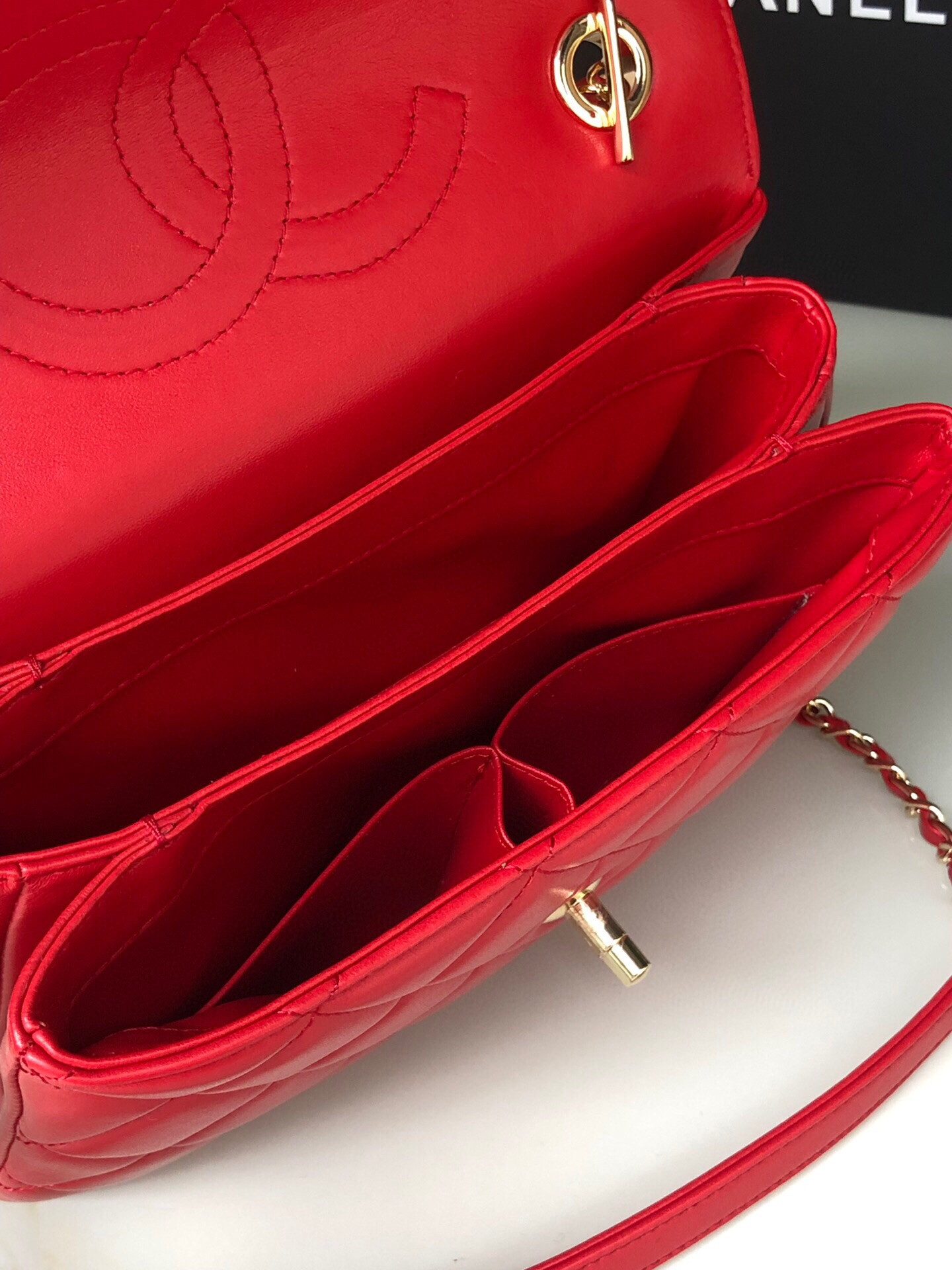 Ch*el flap bag with top handle 6.6 × 9.8 × 4.7 in
