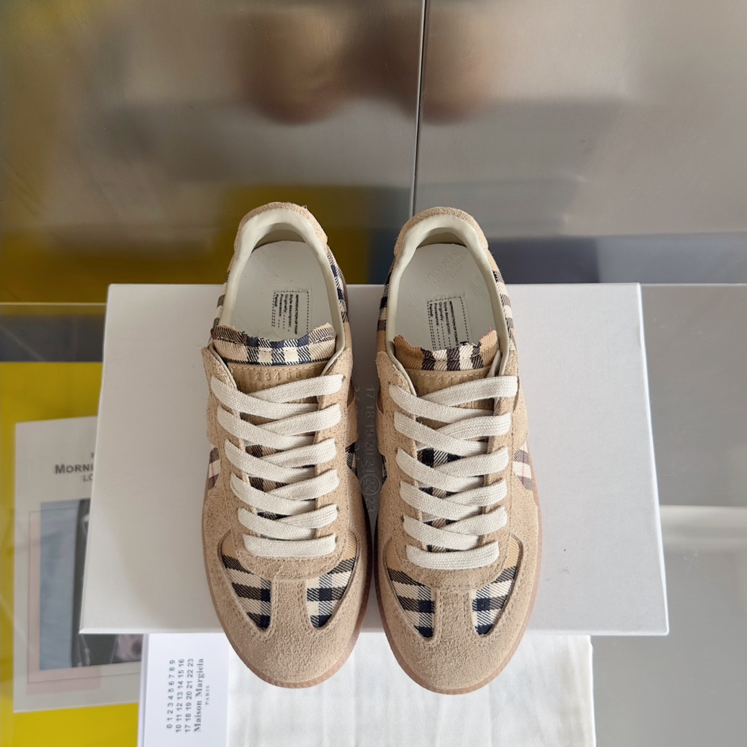ua ma*s*n Ma*i*la mm6 sneakers