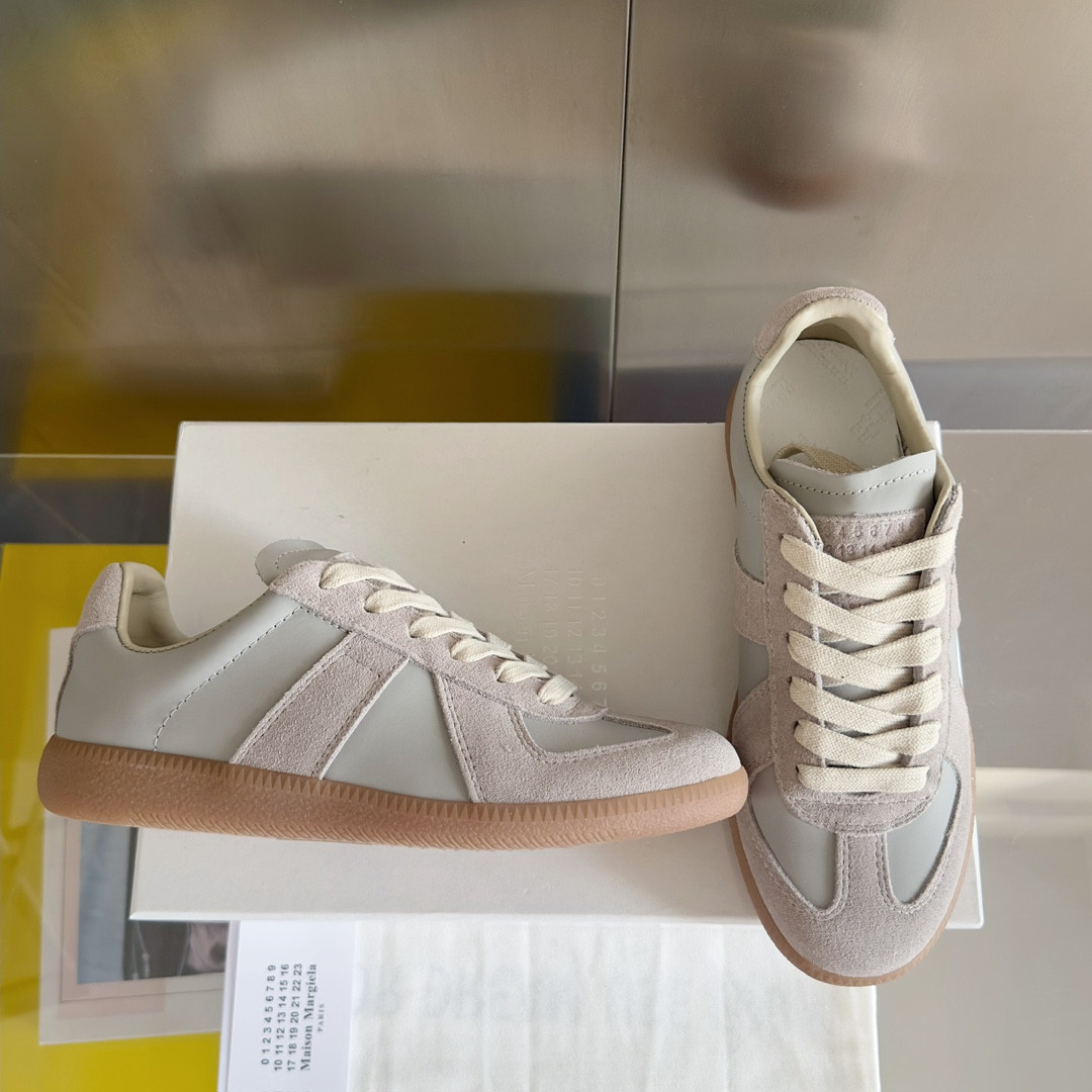 ua ma*s*n Ma*i*la mm6 sneakers