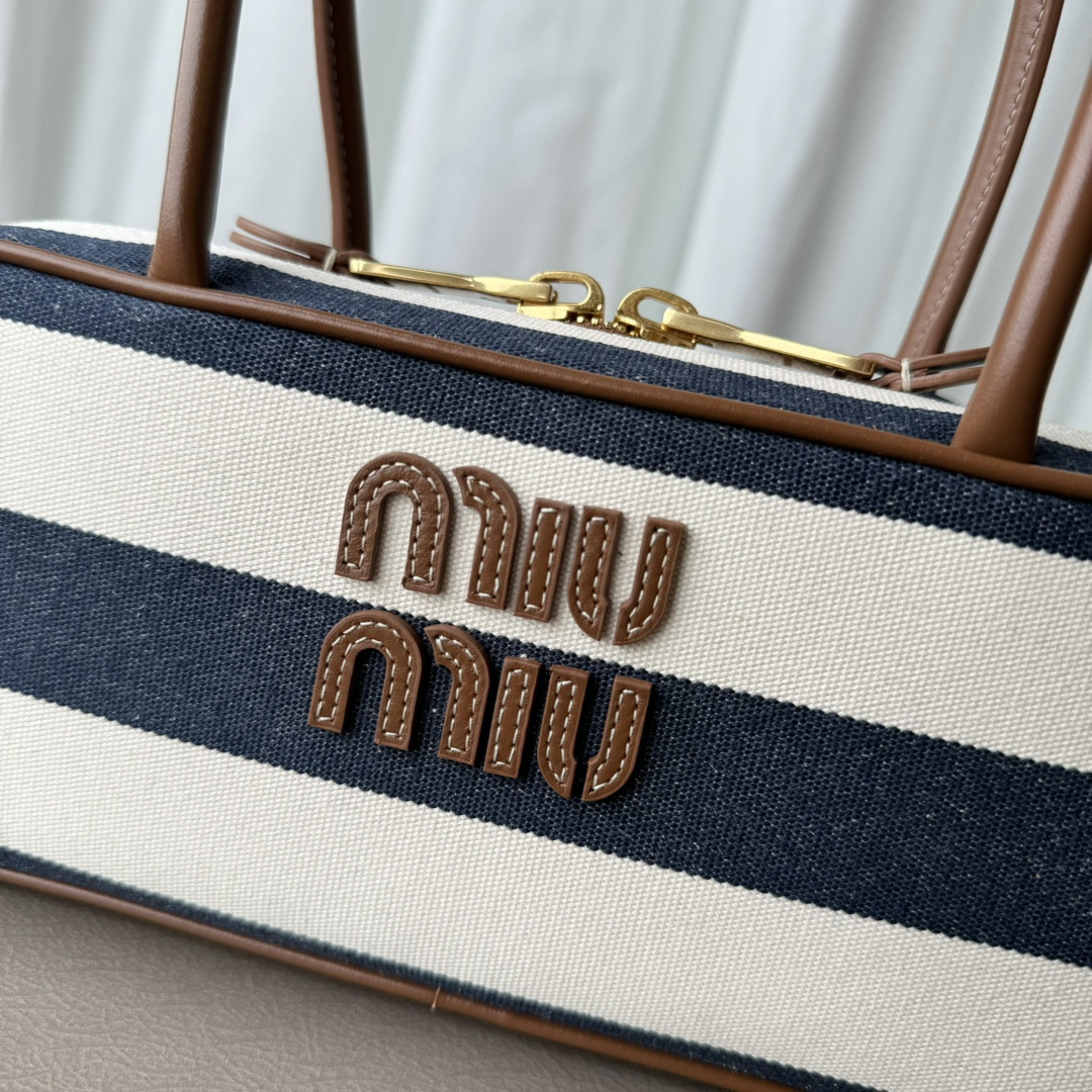 Miu Miu Beau canvas and leather bag 11.5x28x8cm