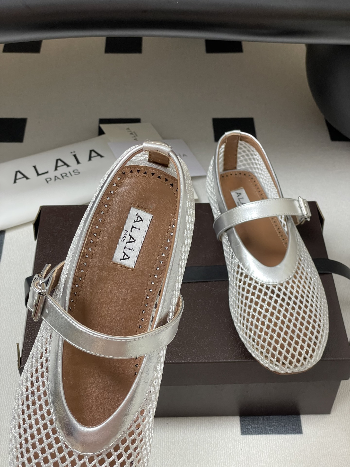 UA ALAÏA BALLET FLATS IN FISHNET