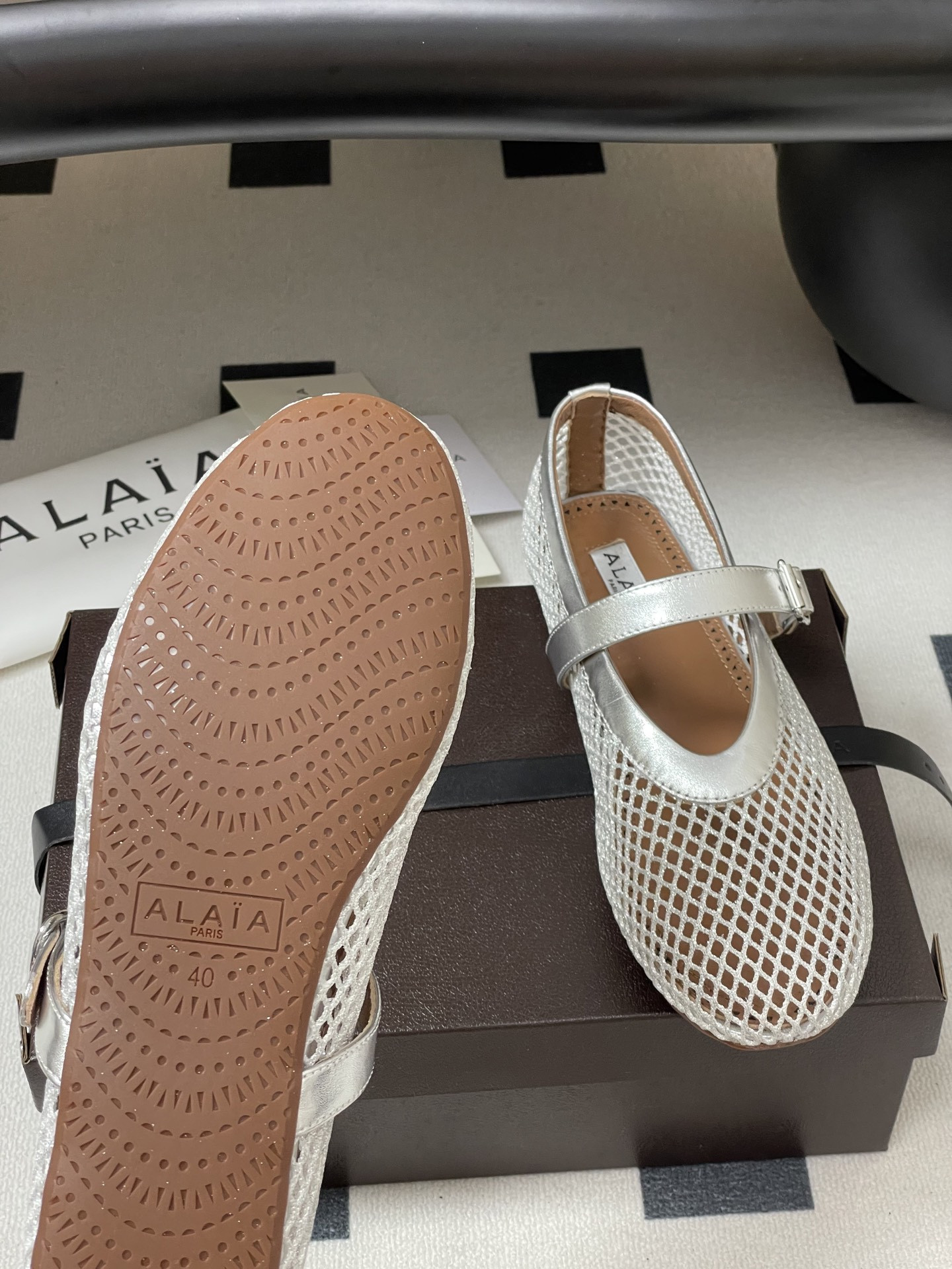 UA ALAÏA BALLET FLATS IN FISHNET