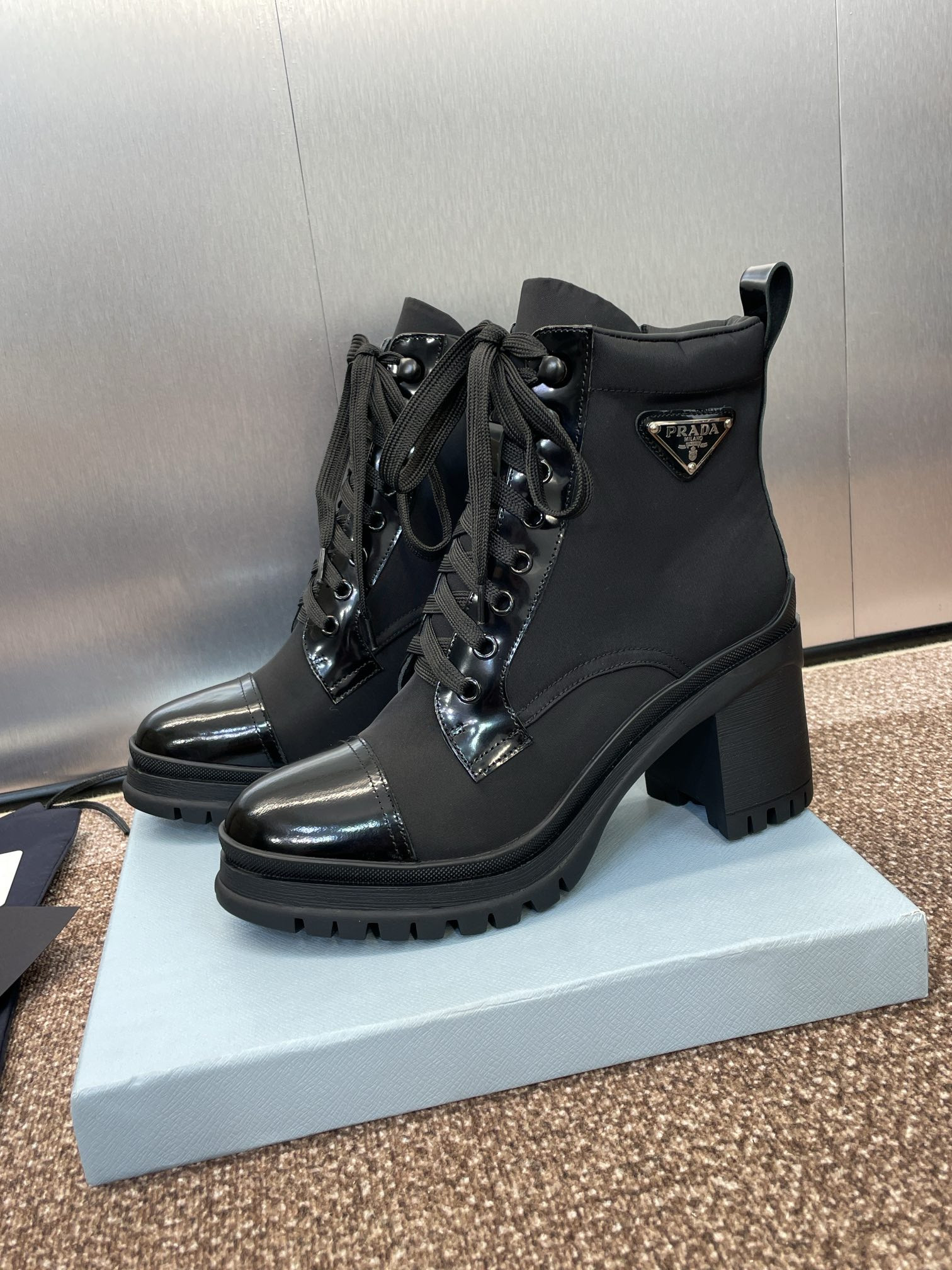 ua Pra*a re-nylon and leather booties